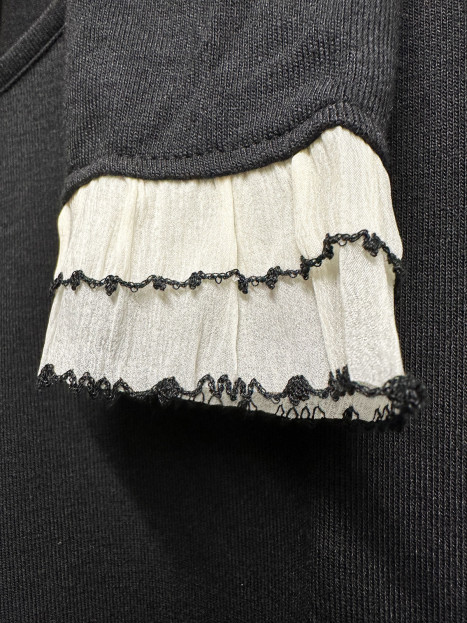 Topp Belaisca svart blomapplikation från Bariloche