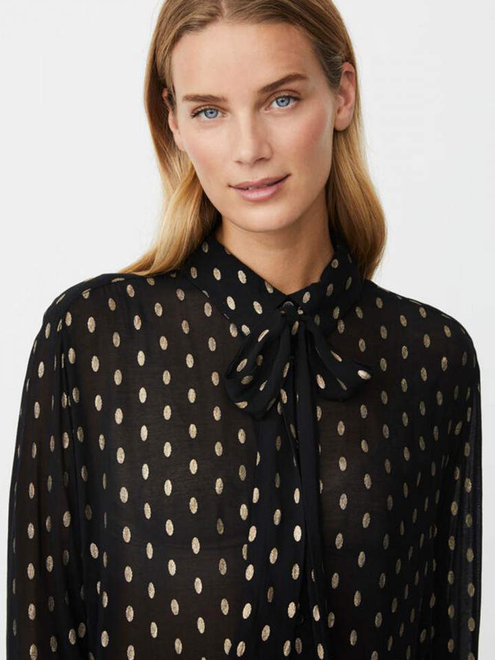 Knytblus Inoria svart guldprick från...