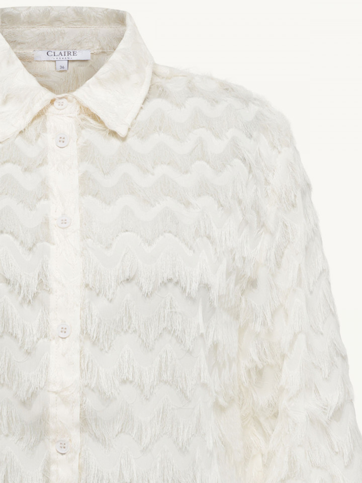 Blus fransar cremevit från Claire