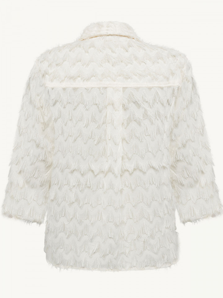 Blus fransar cremevit från Claire